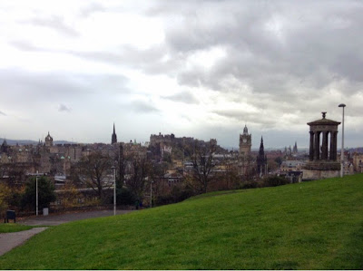 view of edinburgh including castle, royal mile, scott monument and balmoral, taken from calton hill