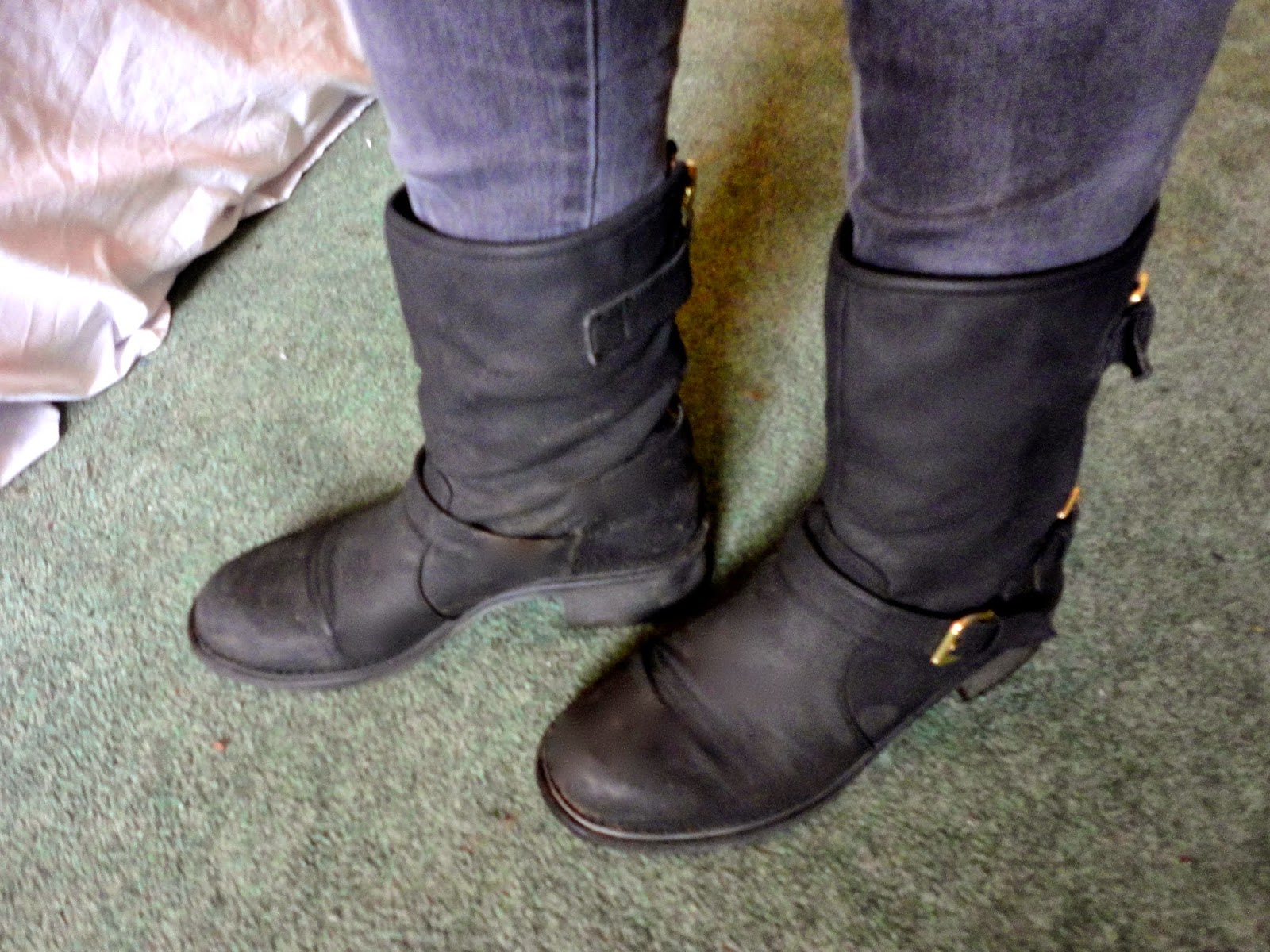 Black biker boots with grey skinny jeans