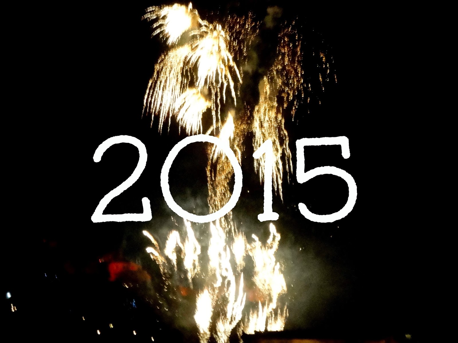 2015 text on New Year fireworks background from Edinburgh Hogmanay