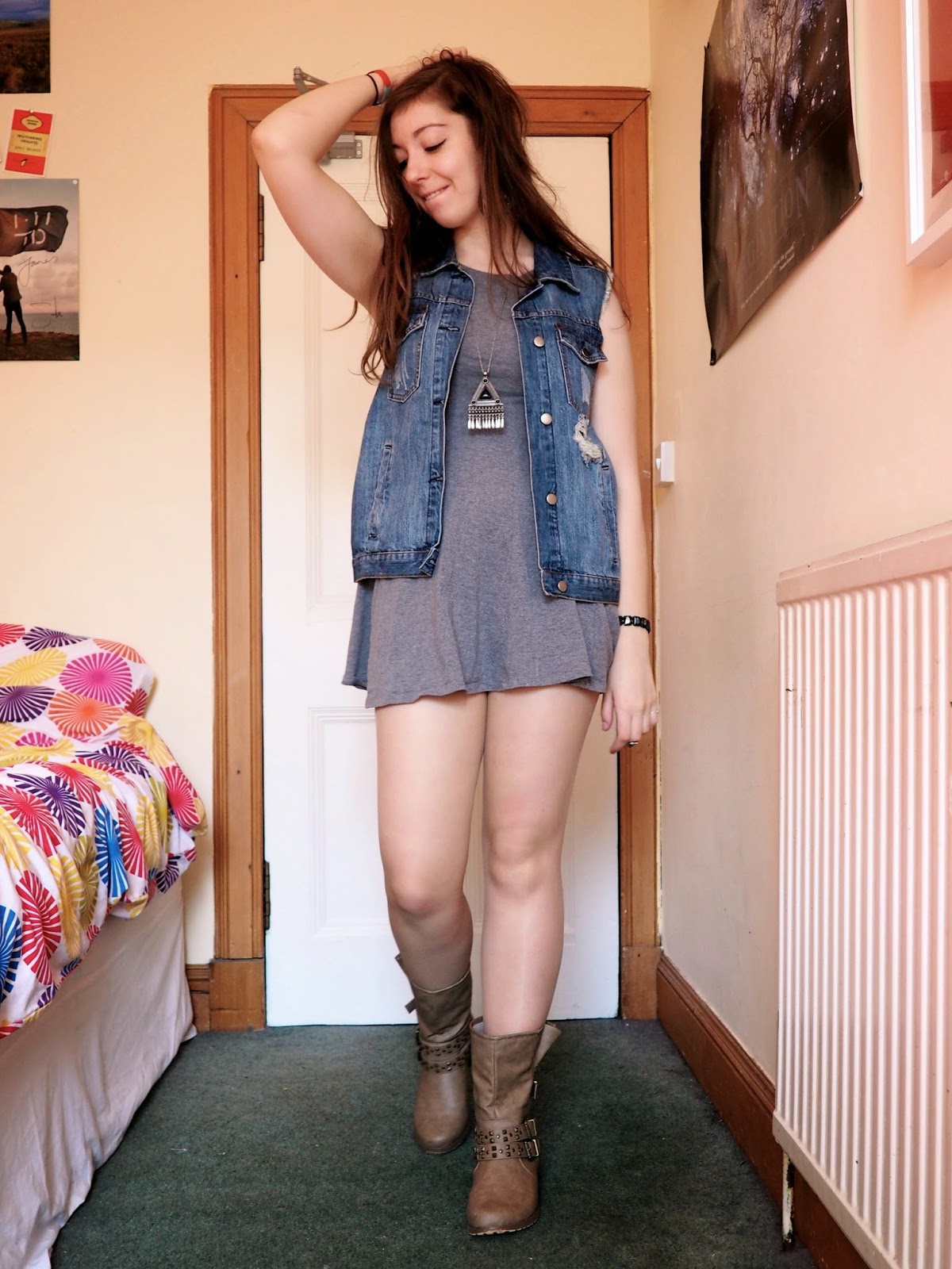 Distressed Denim outfit | ripped denim vest, short grey dress, brown studded boots
