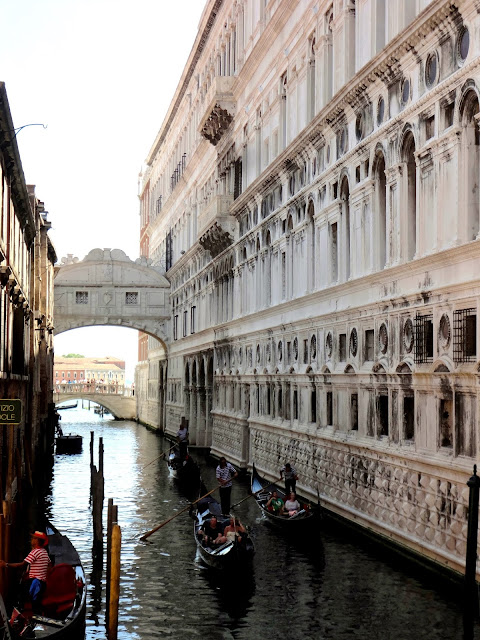 Gondolas passing under the Bridge of Sighs in Venice, Italy