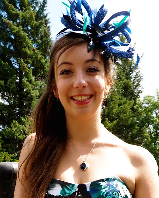 Turquoise Tranquility - wedding outfit details of blue and green fascinator and black jade earrings and necklace