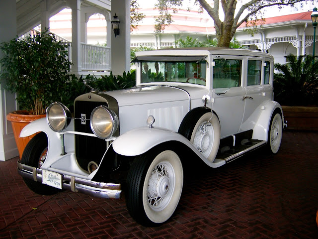 Old fashioned Victorian white car outside Grand Floridian, Disney World, Florida