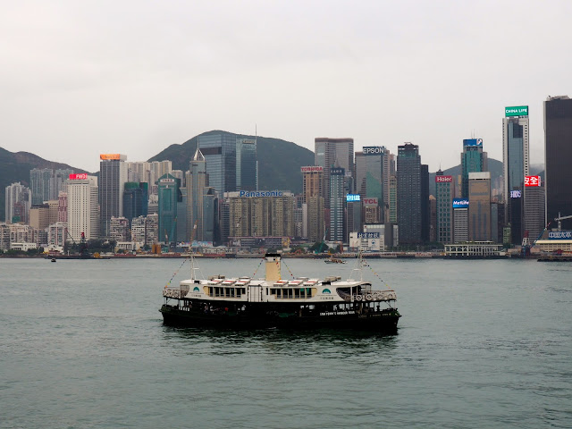 View of Hong Kong island skyline & Star Ferries boat from TST, Kowloon