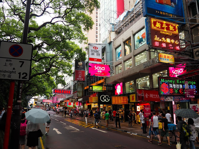 Average busy street in Tsim Sha Tsui, with shops, pedestrians and colourful signs