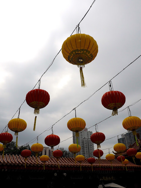 Red & yellow Chinese lanterns hanging above the courtyard of Sik Sik Yuen Wong Tai Sin Temple, Hong Kong