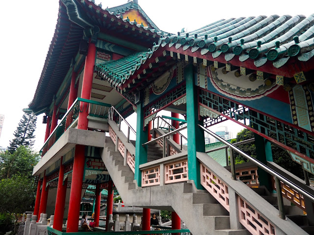 Traditional Chinese architecture of the pavilion on the pond in the garden of Sik Sik Yuen Wong Tai Sin Temple, Hong Kong