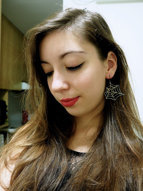Something Wicked | outfit details of spider web earrings and deep red lipstick