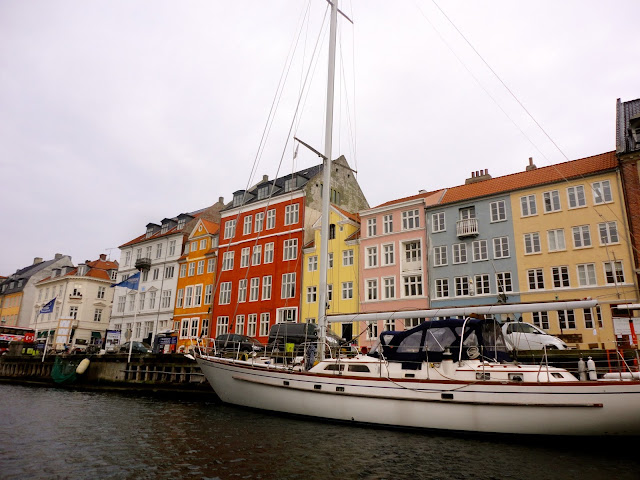 Colourful houses and boats in the harbour at Nyhavn, Copenhagen, Denmark