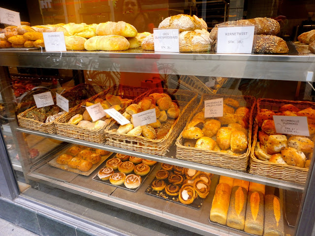 Bread and cakes in a bakery window in Copenhagen, Denmark
