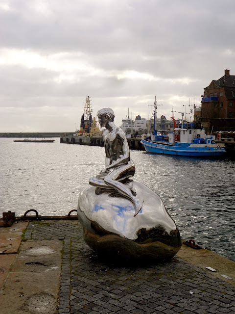 Silver boy statue at Helsingor, Copenhagen, Denmark