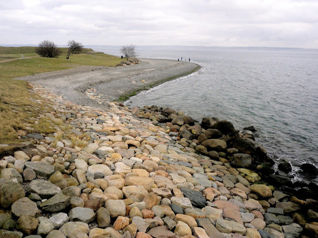 Coastal views and pebble beach beside Kronborg Castle, Helsingor, Copenhagen, Denmark