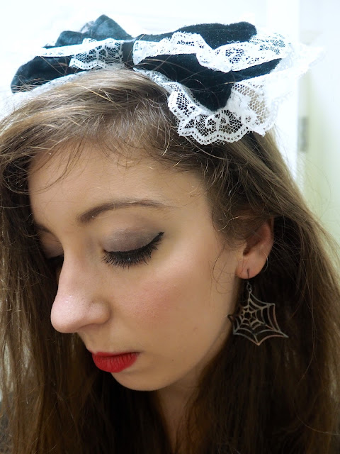 Fright Nights | maid fancy dress outfit details of black and white frilly bow headband and spider web earring