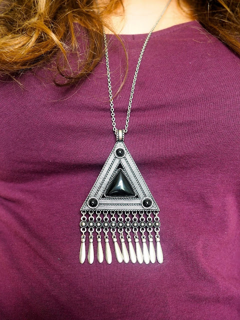 Shades of Midnight | outfit jewellery details of large statement pendant, with black and silver triangular tribal design
