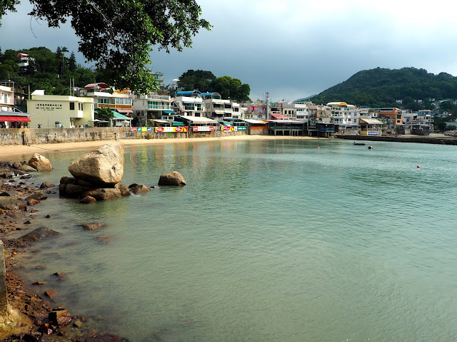 Houses of Yung Shue Wan by the sea and harbour, Lamma Island, Hong Kong