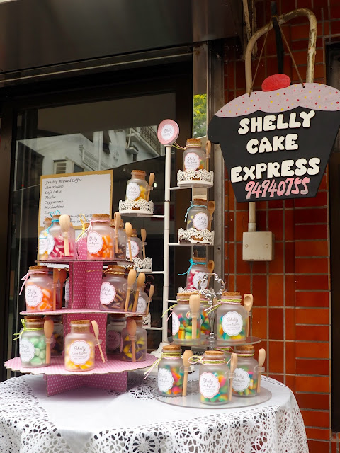 Jars of sweets displayed outside a cake shop in Yung Shue Wan, Lamma Island, Hong Kong