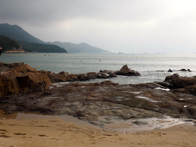 Rock pools and the view out to sea from Hung Shing Yeh beach, Lamma Island, Hong Kong