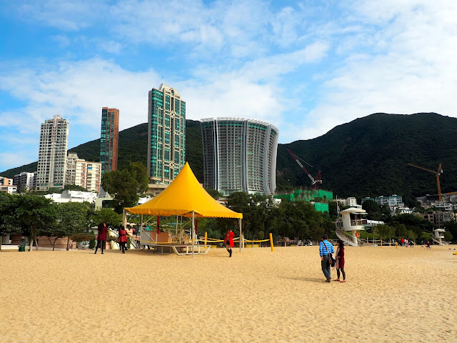 The hills and buildings beyond the sand of Repulse Bay Beach, Hong Kong