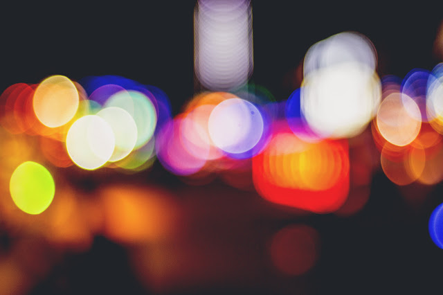 Blurred, hazy colourful city lights at night