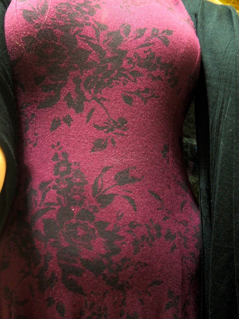 Fly Away | outfit close up shot of black floral design on dark purple dress