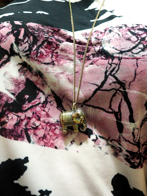 Pic n Mix | outfit jewellery details of a tarnished silver elephant pendant necklace, over a pink & black floral print top