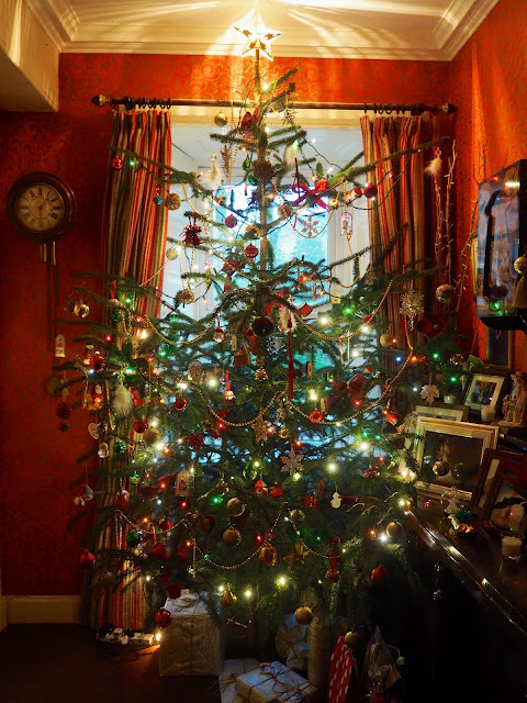 This year's Christmas tree, decorated with ornaments, lights, baubles and a star on top