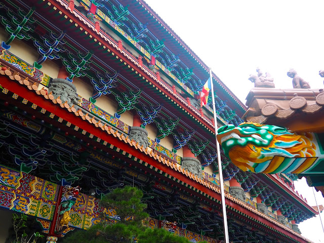 Colourful designs and dragon feature on the exterior of the Hall of Ten Thousand Buddhas, Po Lin Monastery, Ngong Ping, Lantau Island, Hong Kong