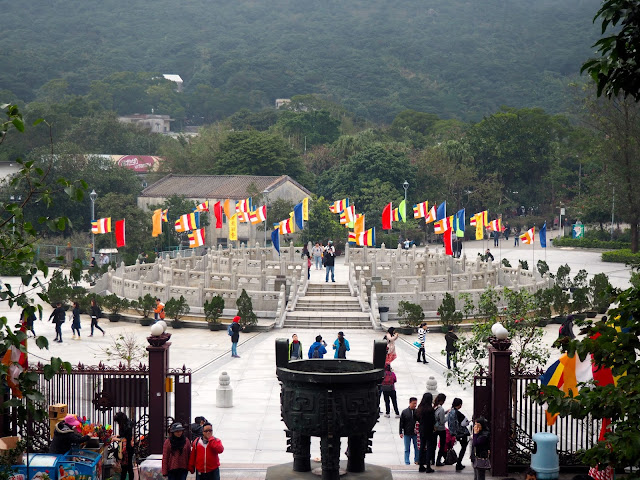 Circular podium and colourful flags in Ngong Ping Piazza, taken from Big Buddha stairs, Ngong Ping, Lantau Island, Hong Kong