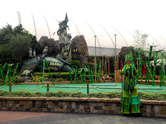 Asian Animals exhibit, with man in bamboo costume, in Ocean Park, Hong Kong