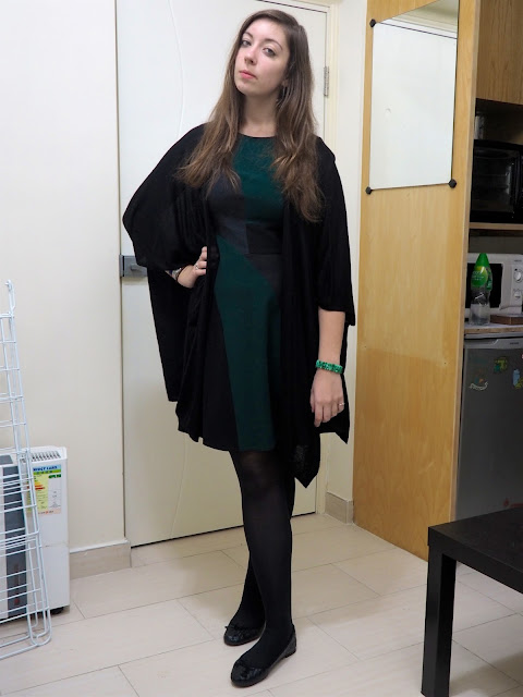 Emerald & Jade | outfit of green, black and grey geometric design smart dress, with black open sleeve draped cardigan, tights & flat shoes