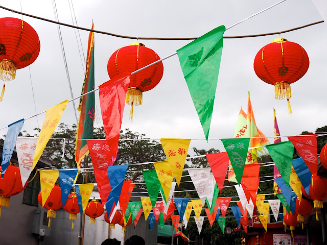 Colourful flags and Chinese lanterns in the streets of Tai O fishing village, Lantau Island, Hong Kong
