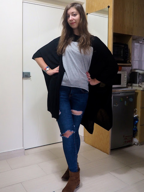 Rough Around the Edges | casual outfit of grey t-shirt, black cape cardigan, ripped jeans and brown ankle boots