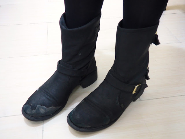 Work in Winter - outfit shoe details of worn out chunky black biker boots, with strap and buckle detailing