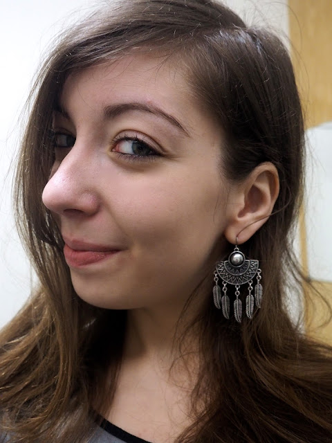Work in Winter - outfit jewellery details of chunky silver earrings, with half circle and feather design