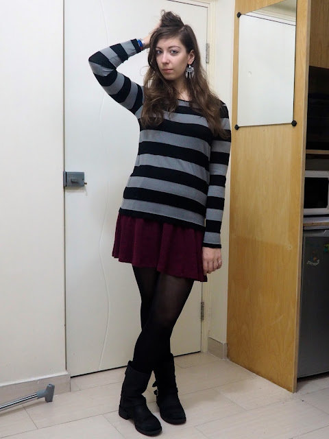Work in Winter | outfit of black and grey striped jumper over short purple dress, with tight and black biker boots