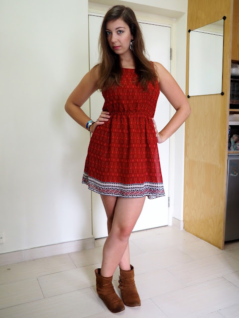 Feel the Sunshine | outfit of a short red patterned summer dress with cut out back, worn with brown ankle boots