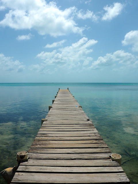 Pier stretching into the ocean around Caye Caulker, Belize