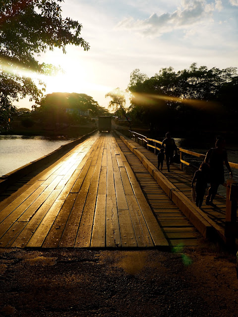 Wooden bridge into San Ignacio, Belize, at sunset