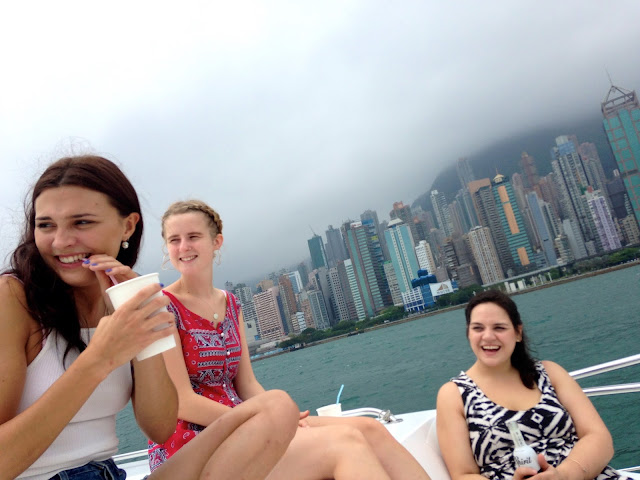 Girls on a junk boat in Victoria Harbour, Hong Kong