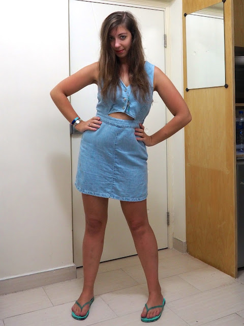Dressing in Denim | light blue denim dress with cut out middle, with blue flip flops and silver pendant necklace