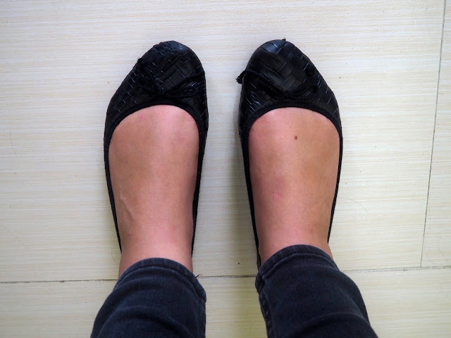 Nightfall - outfit shoe details of flat black ballet pumps with bows, worn with grey skinny jeans