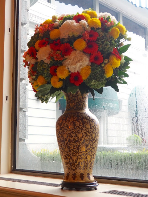 Large vase of flowers decorating The Lobby in The Peninsula, Hong Kong