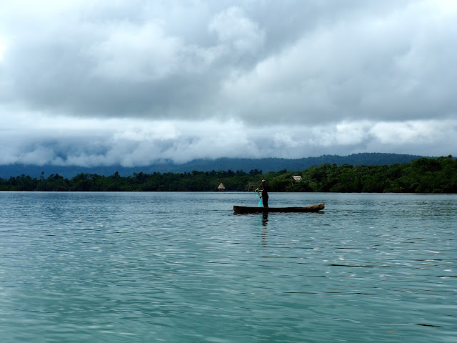 Local fishing from his boat on Lake Izabal, Guatemala