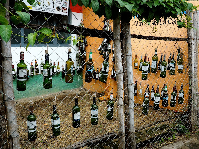 Wine bottle artwork on the streets of San Pedro, Lake Atitlan, Guatemala