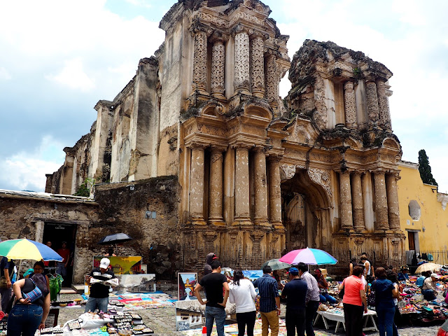 Market outside a crumbling church in Antigua, Guatemala
