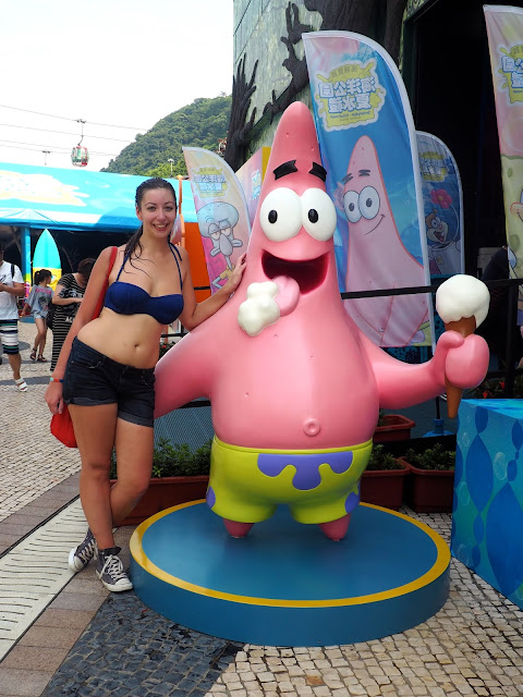 Posing with Patrick statue at the Spongebob Squarepants water playground feature at Ocean Park