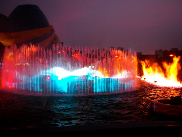 Fountains and flames on the lagoon in Symbio show, Ocean Park