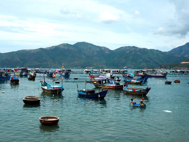 Traditional fishing boats moored by one of the islands near Nha Trang, Vietnam