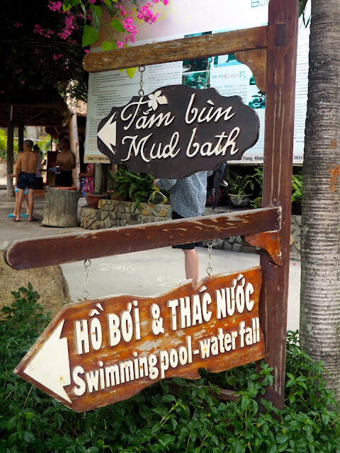 Mud bath and swimming pool sign post in Thap Ba spa, near Nha Trang, Vietnam