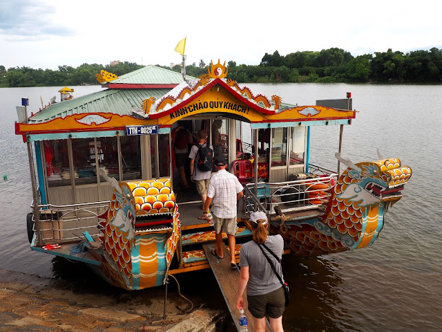 Boarding a dragon boat on the Perfume River, in Hue, Vietnam